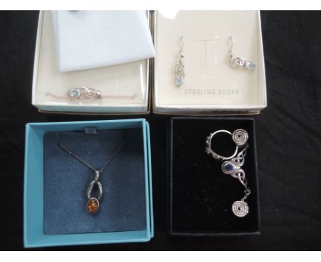 A small selection of white metal and sterling silver jewellery including Celtic knot pendant, baltic amber pendant, earrings 