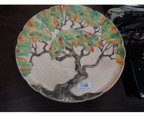 A Carltonware wall plaque in autumnal oak tree pattern on cream ribbed ground
