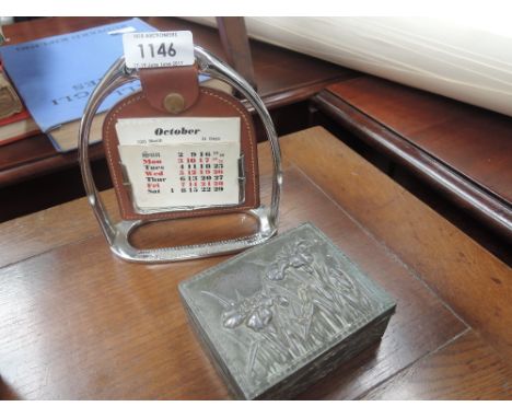A vintage desk calendar modelled as horse stirrup and a pewter trinket