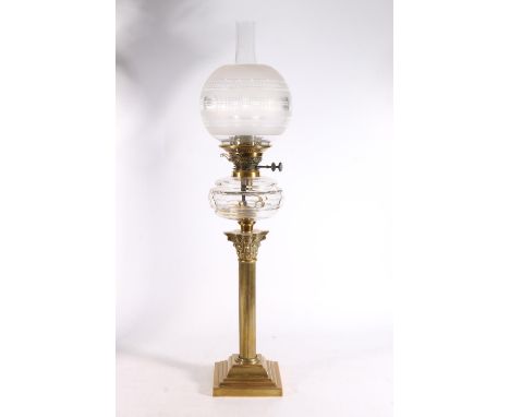 Antique brass Corinthian column oil lamp having faceted glass reservoir and opaque glass shade, with wick adjusters stamped f