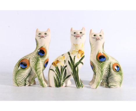 Griselda Hill Wemyss Pottery, a pair of cats with peacock tail feather decoration, signed with artist initials 'ES', 18cm tal