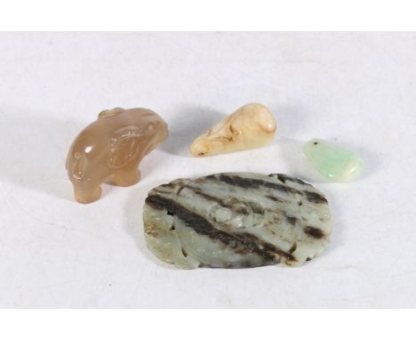 Hardstone belt buckle, a hardstone elephant model, a jade style pendant and another (4). 