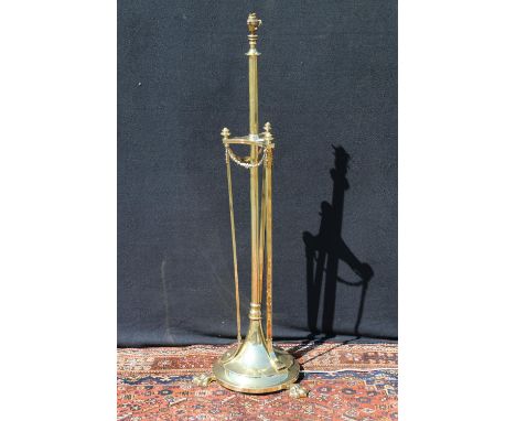 Art Nouveau brass telescopic standard lamp, raised on three paw feet, having swag decoration, 140cm high. 