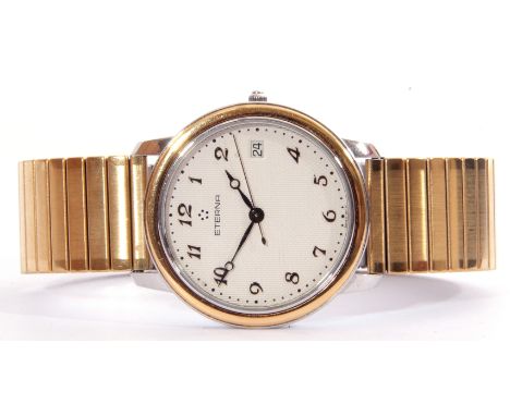 Gold plated and steel quartz centre seconds calendar wrist watch, Eterna, the quartz movement to an engine turned dial with a