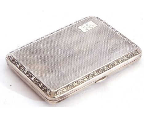George V silver cigarette case of rectangular form, engine turned decoration back and front with chased and engraved borders,