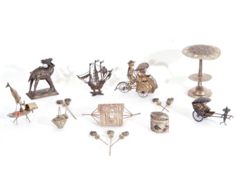 Mixed Lot: a small group of Oriental/Foreign white metal souvenir wares including figure propelled carriages, camel, cocktail