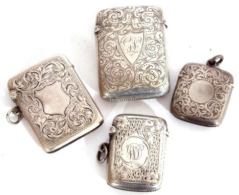 Four vesta cases: the first of flattened rectangular form, foliate engraved and with large vacant shield cartouche, 5cm x 3.5