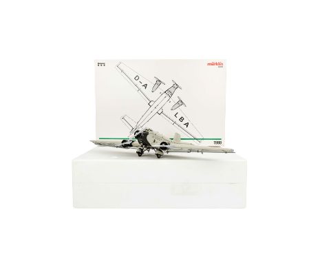 MÄRKLIN Propellerflugzeug 'JU 52', Nr. 1980, Sonderedition von 1996, beige-/grau lackierte Blechausführung, bewegliche Steuer