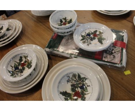 A quantity of Portmeirion dinnerware to include tablecloth, plates, bowls etc  