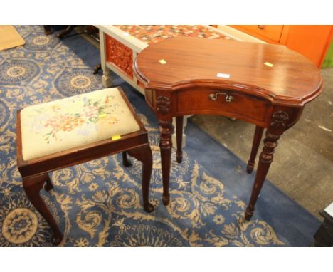 A modern mahogany occasional table with drawer to front, together with a tapestry topped stool