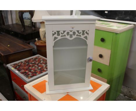 A modern bathroom cabinet with blue and white ceramic handle