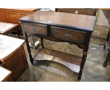 An oak effect hall table with two drawers and shelf below 