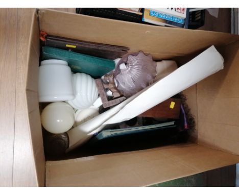 Box of place mats, light shades, money box etc 