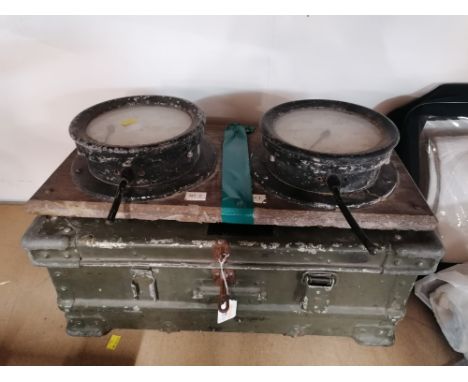 A green metal military style ribbed trunk, 60 cm x 42 cm x 25 cm &amp; 2 circular fuel gauges mounted on a wooden background,