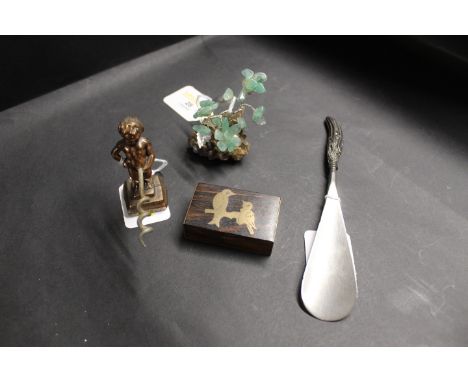 A white metal shoehorn with Birmingham silver handle, a hardwood inlaid miniature box, a continental figural corkscrew and a 