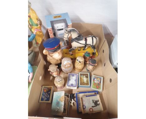 Box of games and playing cards, wooden horse on wheels, monkey ornament, Brian Robot from confused.com etc 