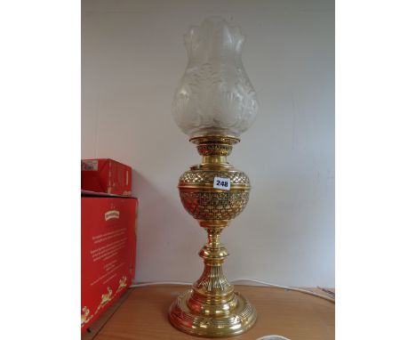 Victorian basket weave design brass reservoir oil lamp with moulded glass shade and clear chimney      