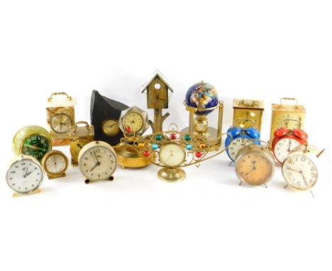 A quantity of alarm, carriage and other clocks, to include a novelty globe shaped clock combined with barometer and thermomet
