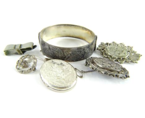 A group of silver and other jewellery, comprising a silver bangle with leaf decoration, a silver floral pendant locket and ch