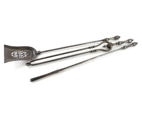 A set of three 19thC steel fire tools, with pierced shovel, tongs and poker, each with a turned handle.