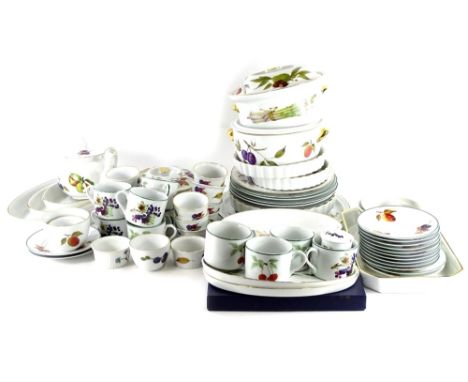 A quantity of Royal Worcester Evesham and Evesham Vale pattern porcelain dinner ware, to include tureens and covers, flan dis