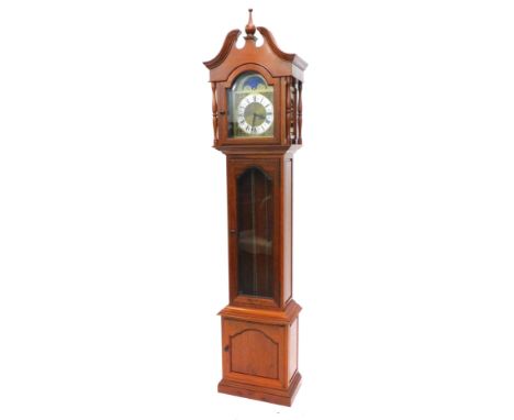 A late 20thC/early 21stC oriental hardwood cased longcase clock, the arch dial with moon phase, and with silvered chaptering,