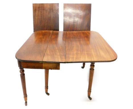 An early 19thC mahogany concertina action dining table, in the manner of Gillows, the rectangular top with a reeded edge and 