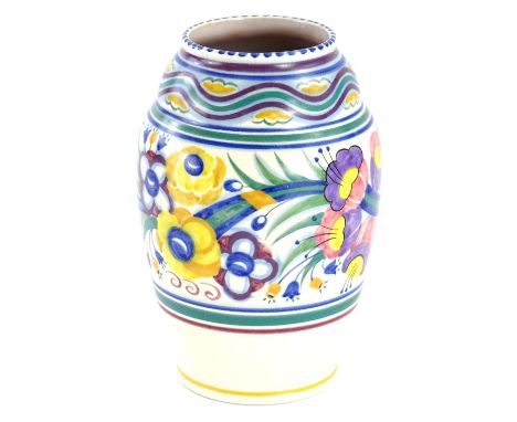 A Poole pottery bullet shaped vase, decorated in typical fashion with flowers, leaves etc., in red, purple, yellow and green,