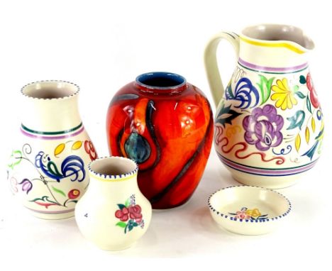 A collection of five items of Poole pottery, to include a later delphis style vase with black backstamp, a large Poole jug wi
