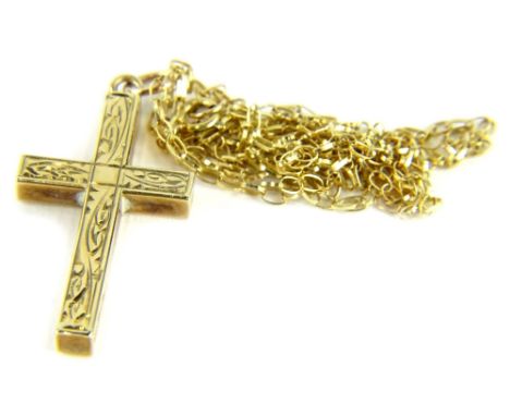 A 9ct gold cross pendant and chain, the small cross with scrolled design, on a fine link chain, the pendant 2.5cm high, the c