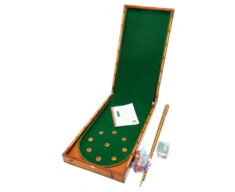 A late 19thC Hamleys, Regent Street bagatelle game, in a mahogany case, 91cm long.