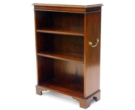 A mahogany open bookcase, the top with a moulded edge above two adjustable shelves flanked by brass handles, on bracket feet,