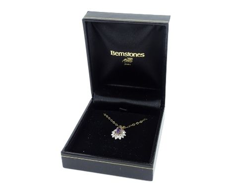 A 9ct gold amethyst and diamond pendant and chain, the pendant set with oval cut amethyst, surrounded by tiny diamonds in whi