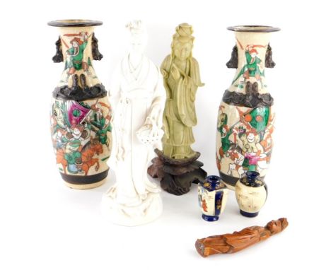 A Chinese porcelain blanc de chine figure of a lady, in flowing robes holding basket of leaves, on shaped foot, hollowed, unm