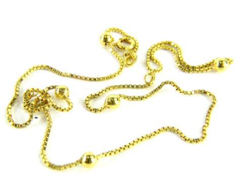 A 9ct gold ball and link chain, with box links and single ball breaks, 39cm long overall, 3g. 