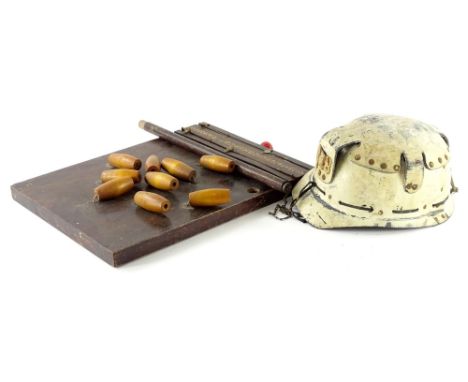 A vintage miners helmet, painted in cream, possibly the Huwood light type hat, indistinct label to underside and a bar skittl