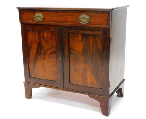 An early 20thC mahogany side cabinet, the top with rounded corners above a frieze drawer, and two panelled doors on bracket f