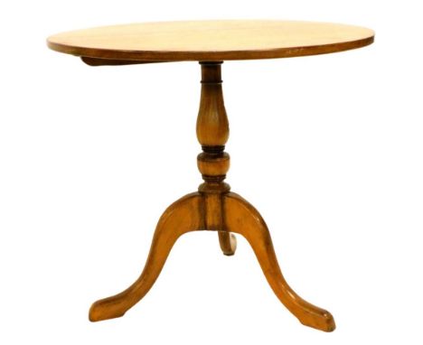 An oak occasional table, the circular top on a turned column and tripod base, 81cm diameter.
