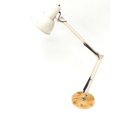 A cream painted Anglepoise reading lamp, on a metal base, 114cm high. (AF)