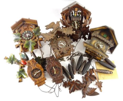 A collection of four Black Forest type cuckoo clock, various models to include examples carved with birds, leaves etc and two