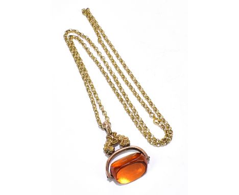 A 9ct yellow gold hoop link chain, length 64cm, suspending an amber coloured yellow metal framed swivel fob, the chain approx