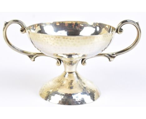 WILLIAM AITKEN; an Edward VII hallmarked silver Arts &amp; Crafts twin handled pedestal bowl with planished finish, Birmingha