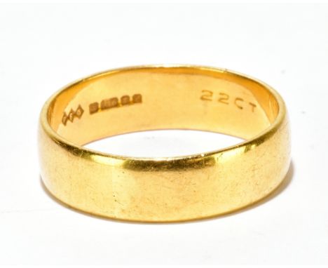 A 22ct yellow gold wedding band, size R, approx 6.4g.Additional InformationThe ring is quite broad, approx 6mm, light surface