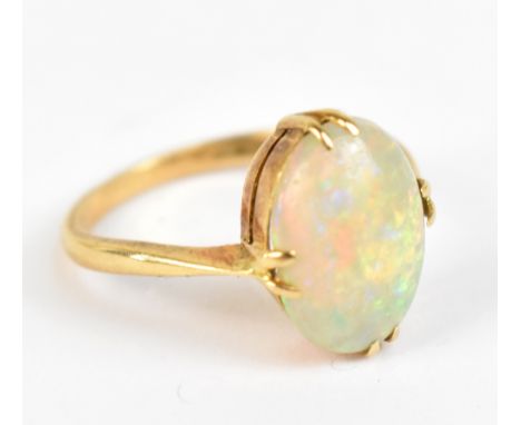 An 18ct yellow gold opal set ring, approx size H, approx 2.6g.Additional InformationHeavy scratches to the opal, wear to the 