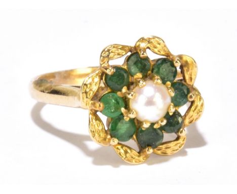 A 9ct yellow gold floral dress ring centred with a cultured pearl, size L, approx 3.6g.Additional InformationThe ring is very