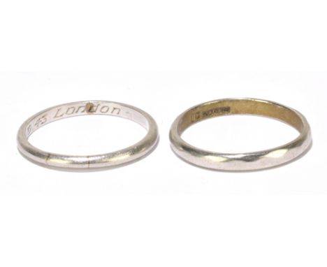 Two platinum wedding bands, the first with internal inscription '12.10.43 London', size P1/2, the second also size P1/2, comb