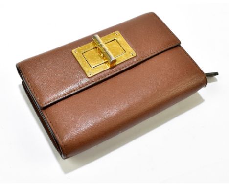 TOM FORD; a brown leather wallet and purse, the wallet contains ten card holders, a separate coin purse, gold tone hardware a