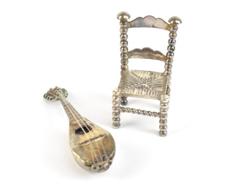 BOAZ MOSES LANDECK; an Edward VII hallmarked silver miniature/dolls' house bobbin turned chair, import marks for Chester 1907