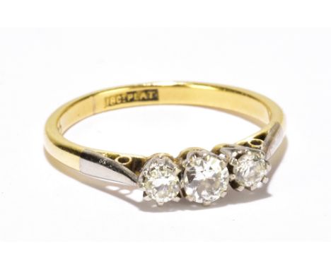 An 18ct yellow gold platinum tipped three stone graduated diamond ring, largest stone approx 0.20ct, size K1/2, approx 2.6g.A