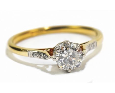 An 18ct yellow gold platinum set diamond solitaire ring, the diamond weighing approx 0.75ct, size N, approx 1.8g.Additional I